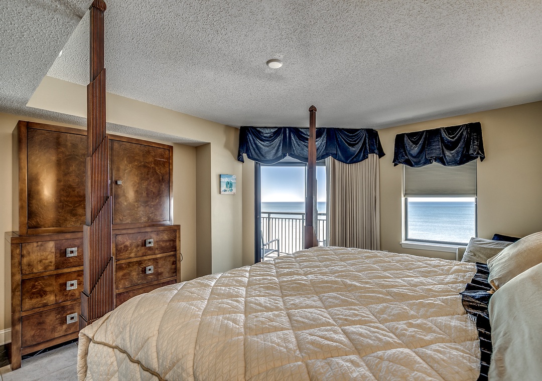 King primary suite with balcony access