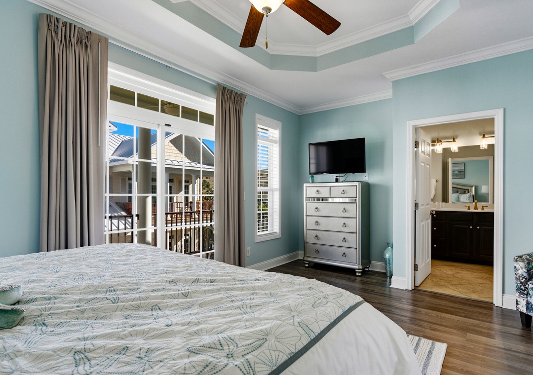 Primary bedroom with balcony access