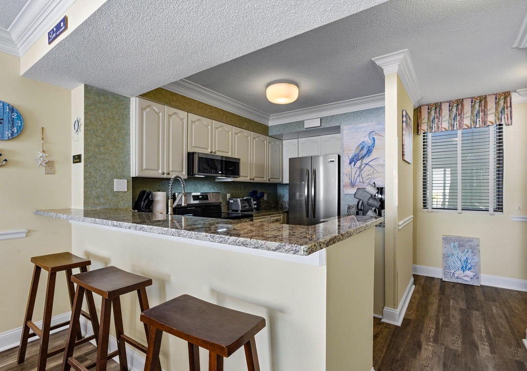 Kitchen has a fun eat-in bar