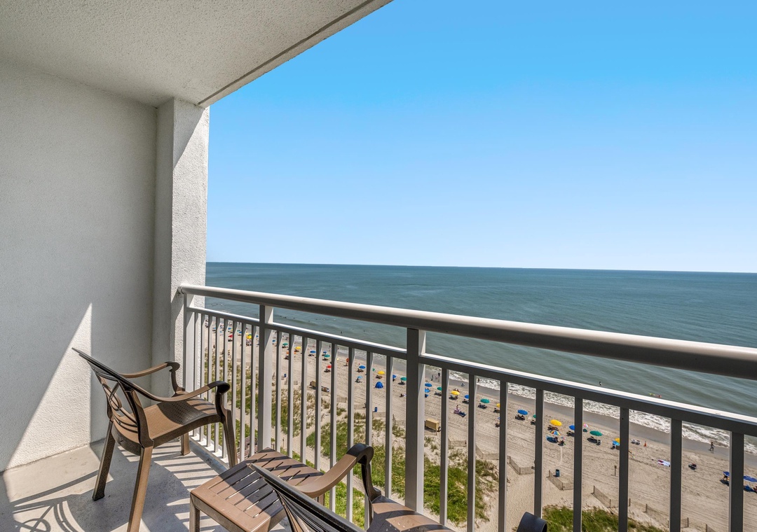 Sweeping coastline view—watch the shoreline, pools, and beach activity from above.