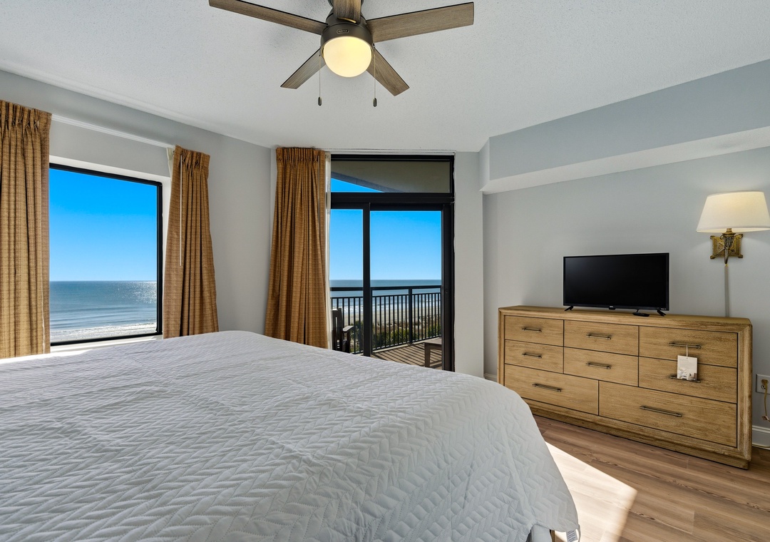 Primary bedroom with private balcony access