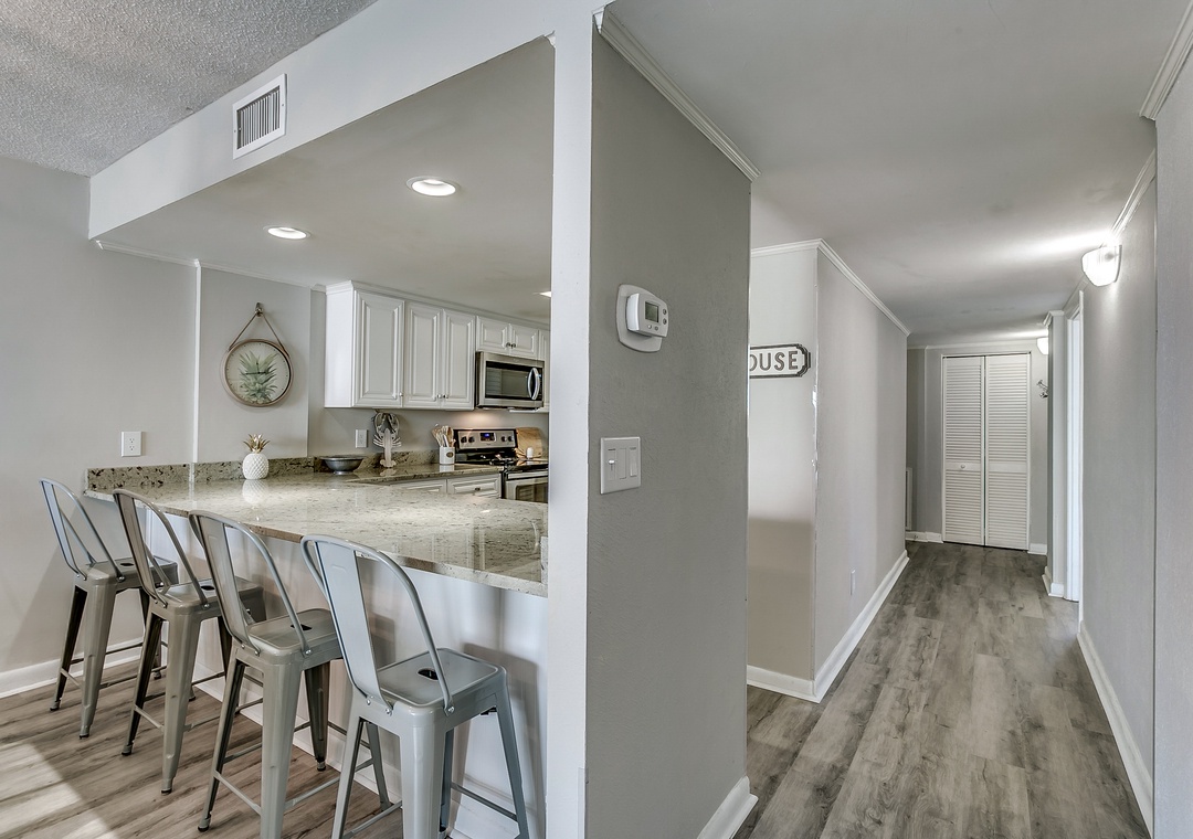 Kitchen has eat in bar for extra dining space