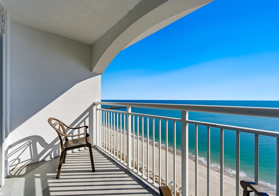 watching beachgoers enjoy the pristine sand below.