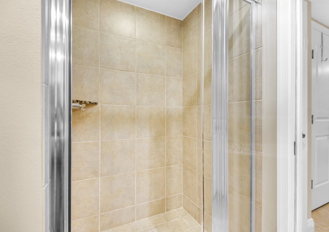 Walk-in shower in the primary ensuite bathroom