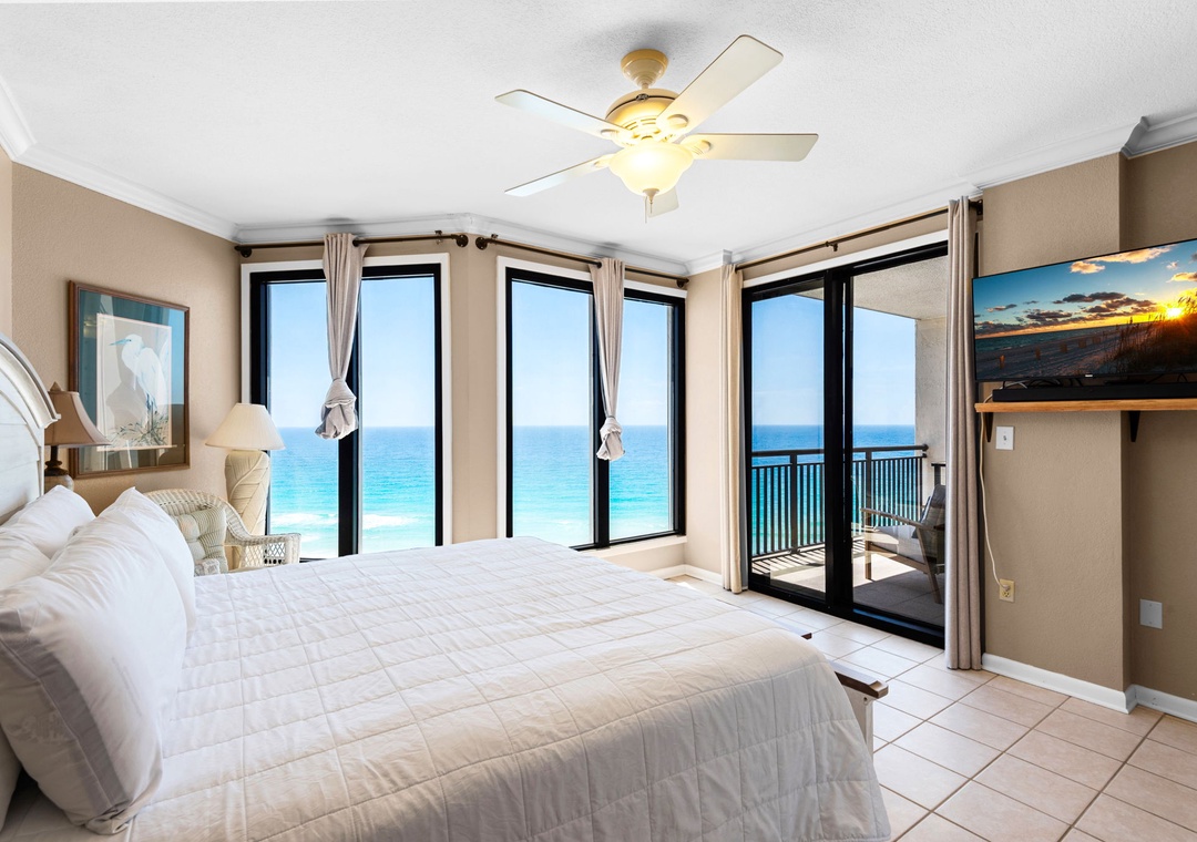 King primary suite with balcony access