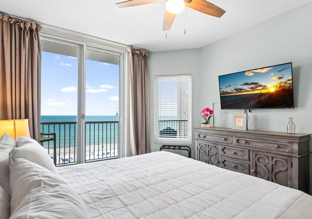 Primary bedroom with balcony access