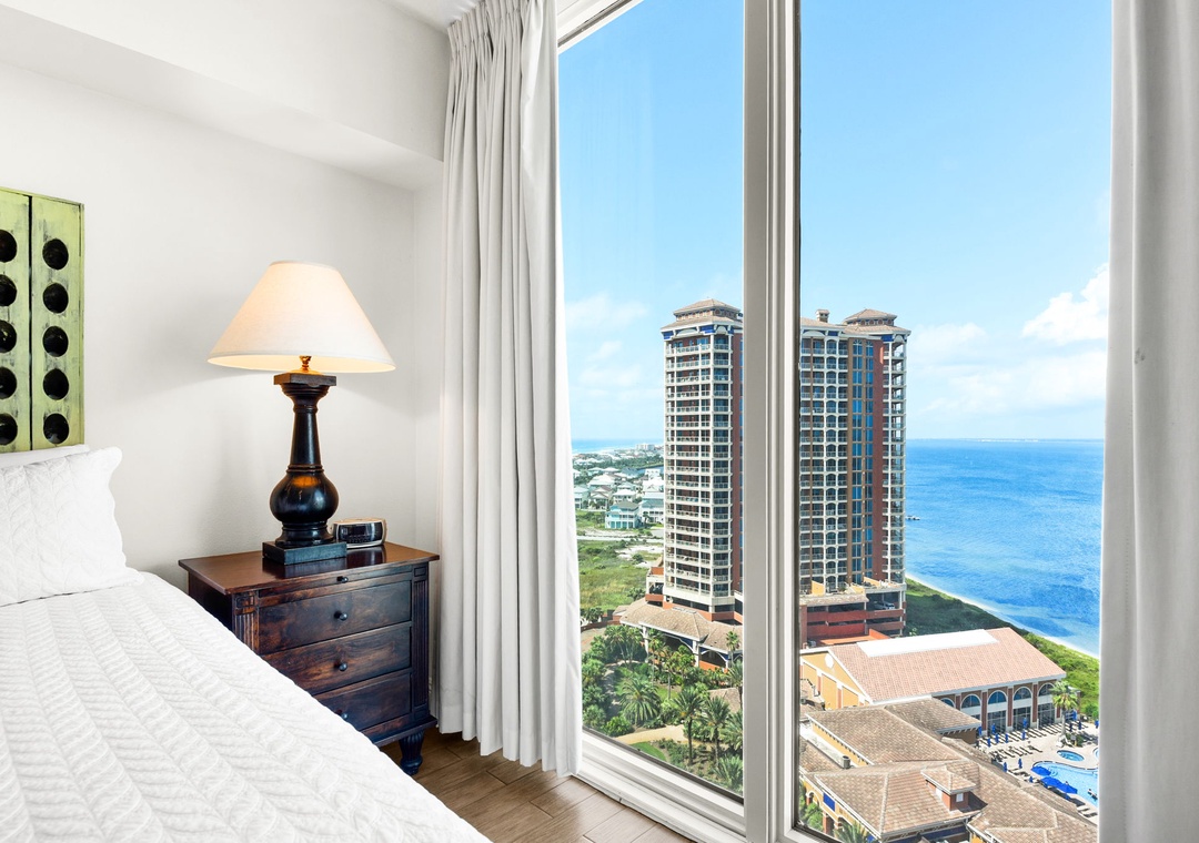 Floor-to-ceiling windows in the guest bedroom