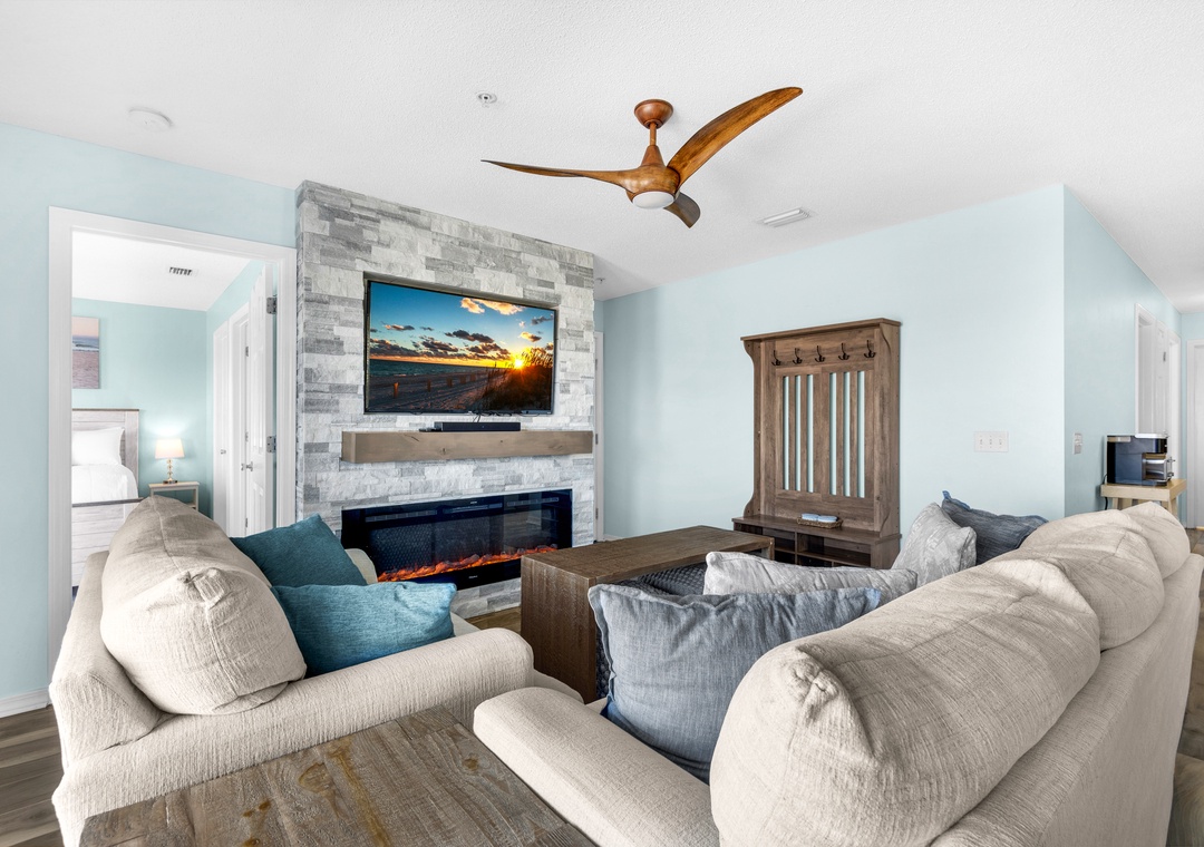 Living room with fireplace and large flat-screen TV
