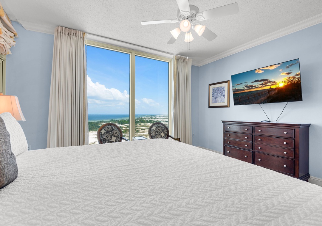 Primary bedroom with balcony access