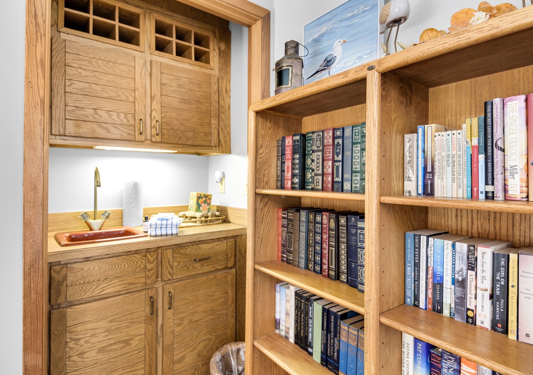 Second floor living space with wet bar and plenty of books