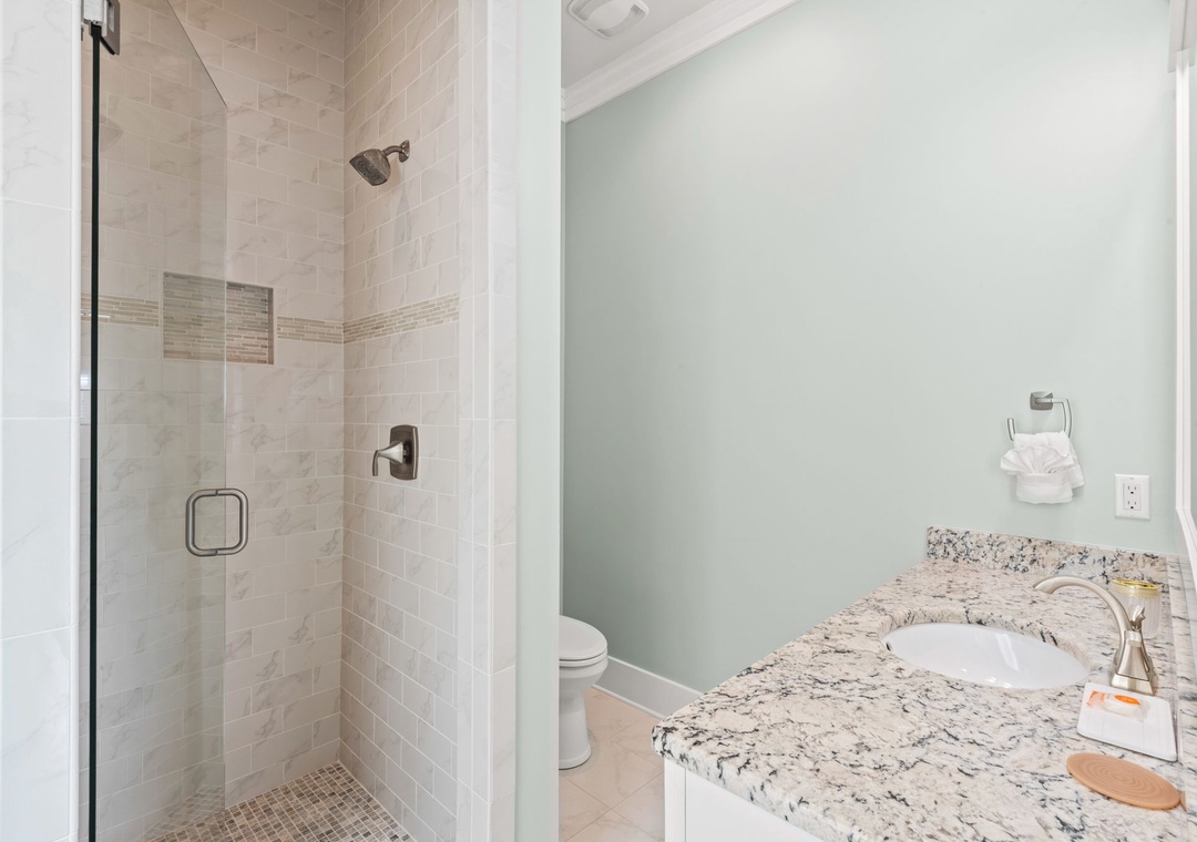 Main floor guest ensuite bathroom with walk-in shower