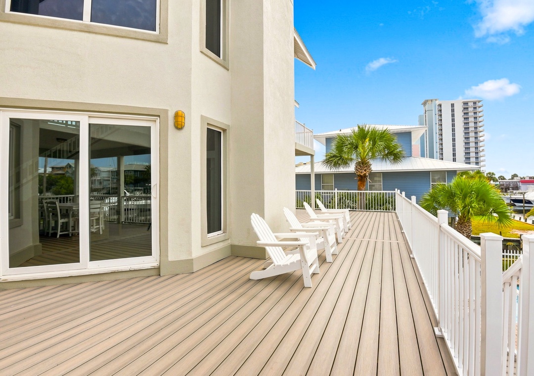 Main floor deck with stairs to the private pool area