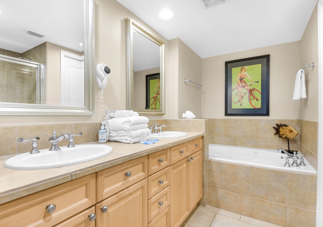 Primary ensuite bathroom with dual vanities