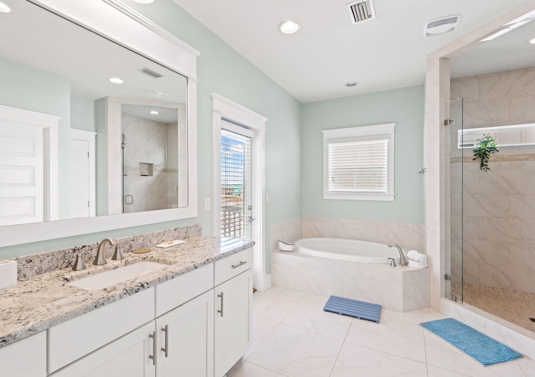 Second floor primary ensuite bathroom with walk-in shower and garden tub