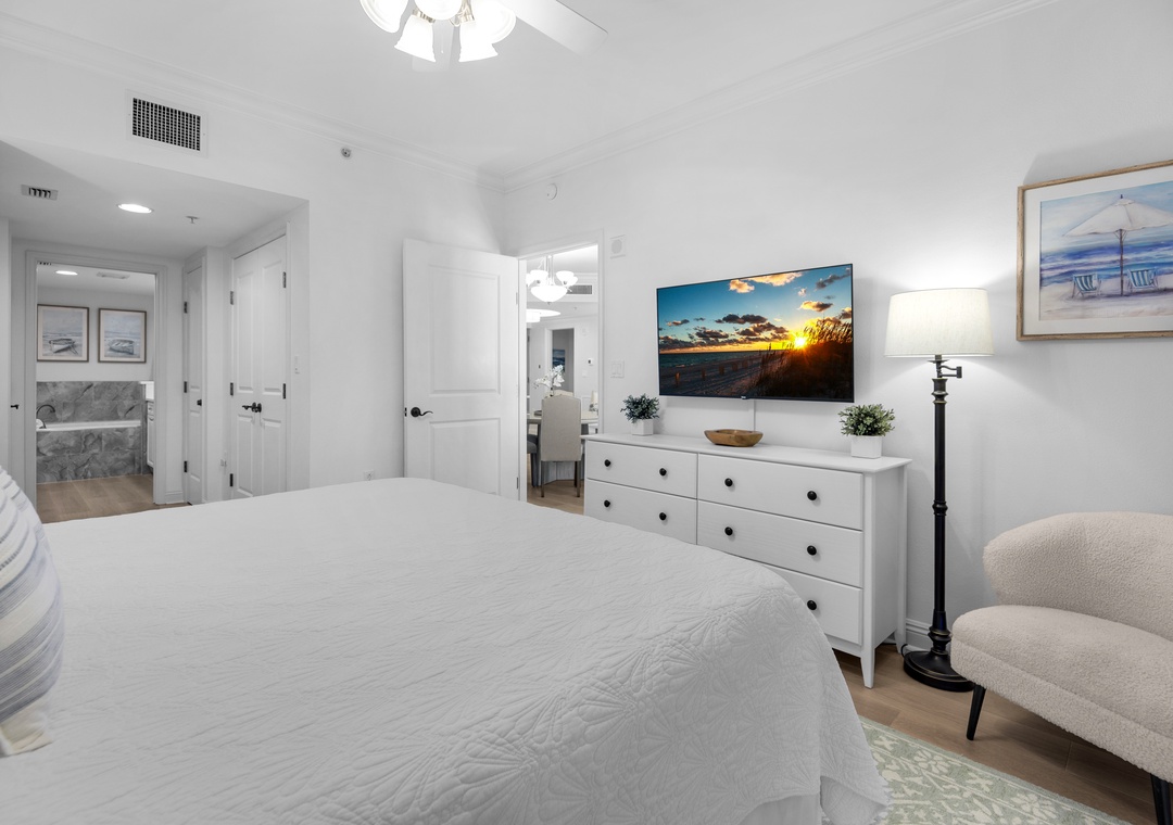 Wind down with a movie on the large TV in the primary suite