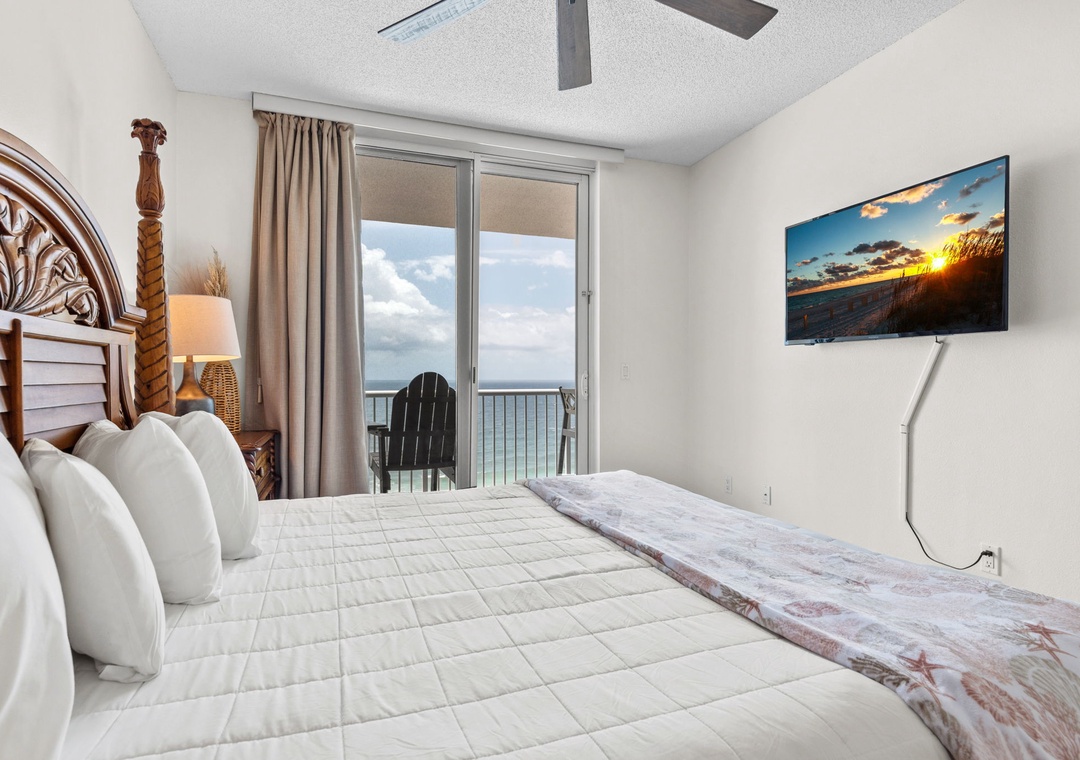 Primary bedroom with balcony access