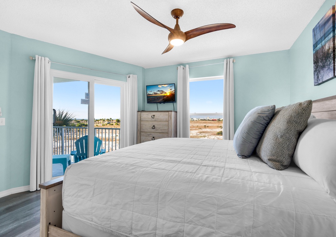 Primary bedroom with balcony access