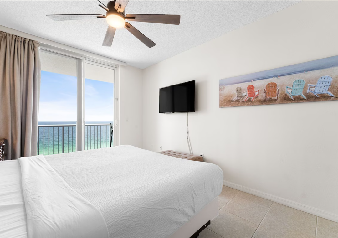 Primary bedroom with balcony access