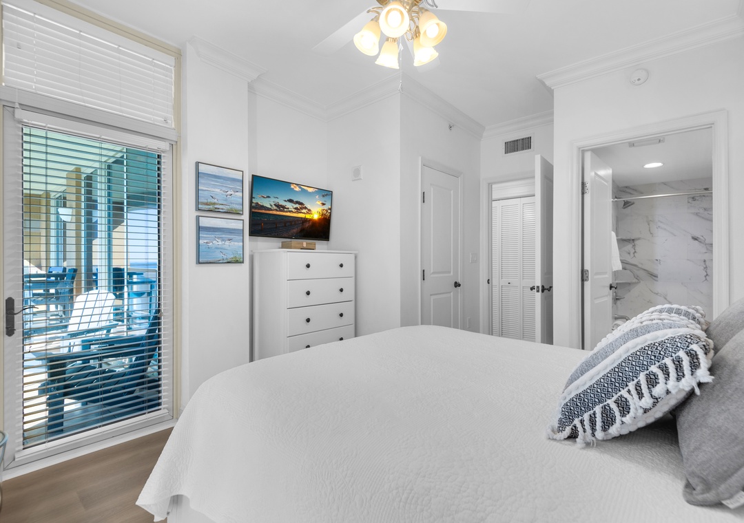 Queen guest bedroom with ensuite bath and flat-screen TV