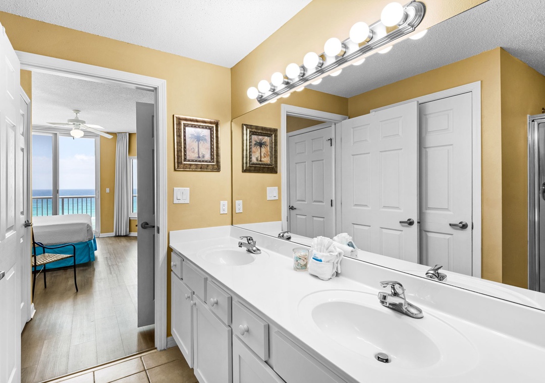 Primary ensuite bathroom with dual vanities