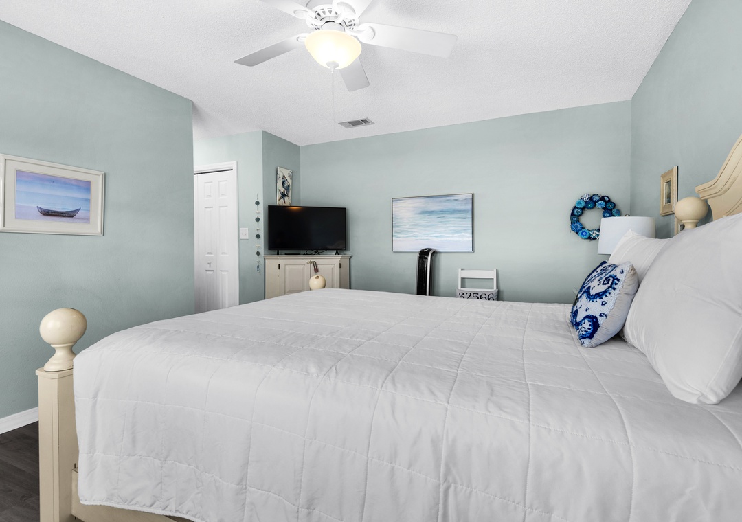 Primary bedroom with flat-screen TV