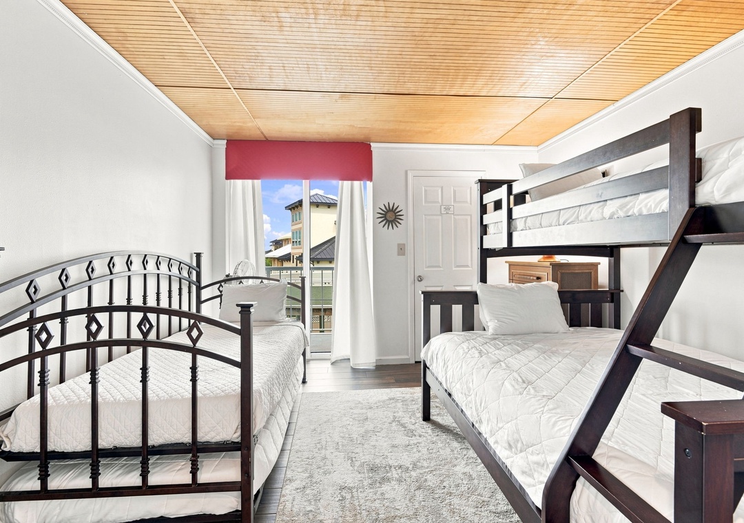 Guest bedroom featuring daybed with twin trundle and twin-over-full bunk bed