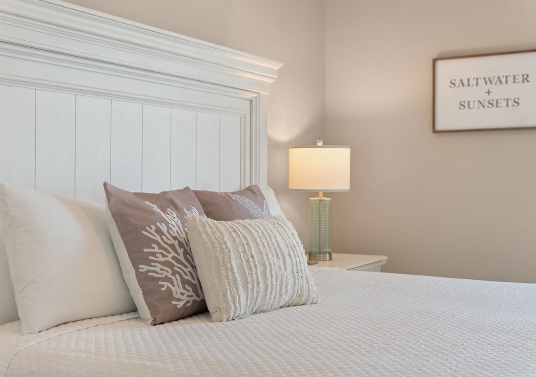 Saltwater & Sunsets- Slip into this coastal-inspired bedroom and feel the day's stresses melt away. Soft pillows invite you to sink in, while gentle lighting sets the mood for peaceful evenings.