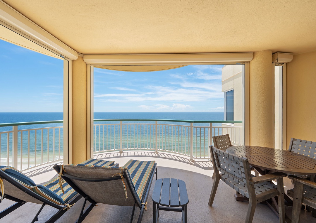 Beach Colony T14B-Private balcony with endless ocean views and the gentle sound of waves. Relax at your outdoor table or sink into comfortable seating while taking in the sparkling sea.
