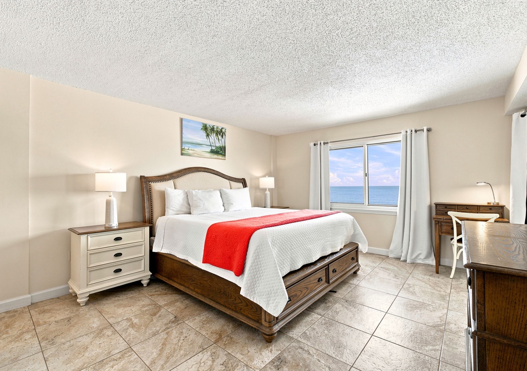 Sandy Key 411- Wake up to stunning ocean views framing your plush bed. Coastal breezes, warm natural light, and elegant furnishings create your perfect seaside retreat.