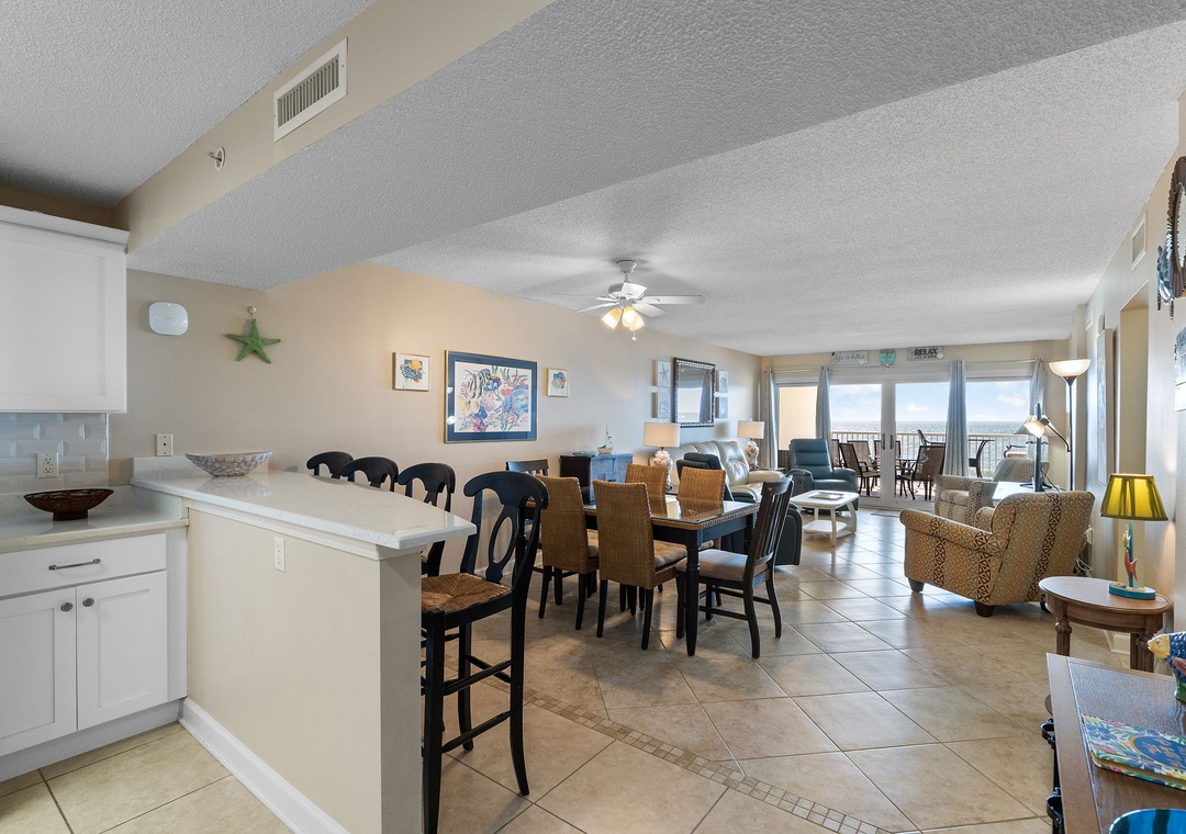 Sandy Key 628- Step into your beachside home-away-from-home, where coastal charm meets comfort. The open-concept living space invites you to gather, dine, and unwind while soaking in stunning ocean views through expansive windows.