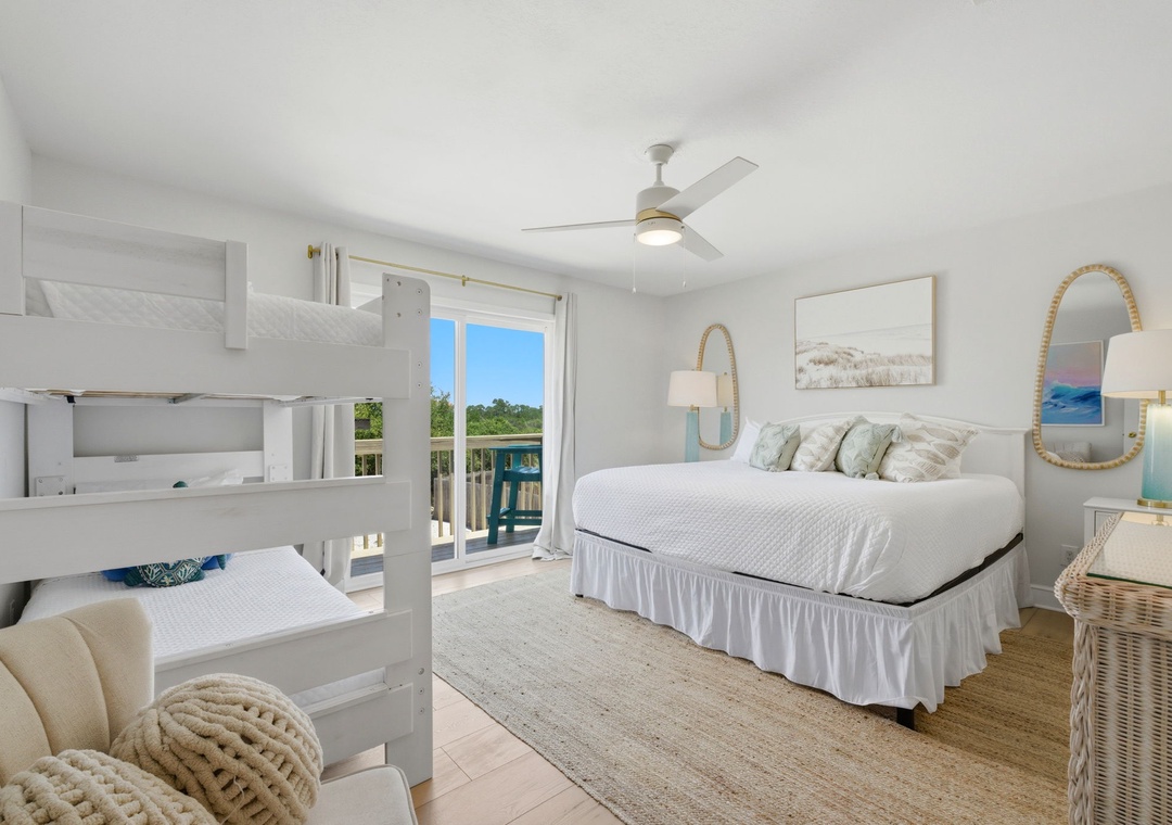 North Lost Key Landing B2- Your coastal-inspired bedroom features plush bedding, a bunk bed for the kids, and private balcony access with serene views—perfect for peaceful mornings and restful nights.