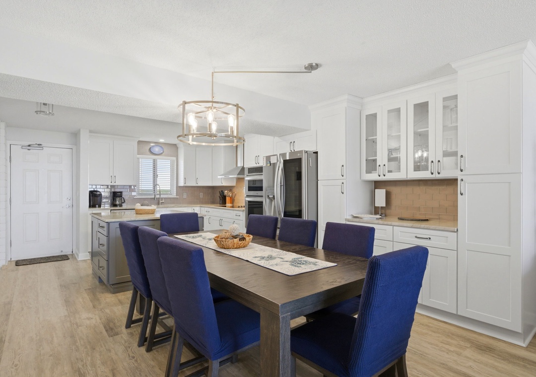 Your fully-equipped gourmet kitchen opens to an inviting dining space where you'll gather for meals, share stories, and create lasting memories together.