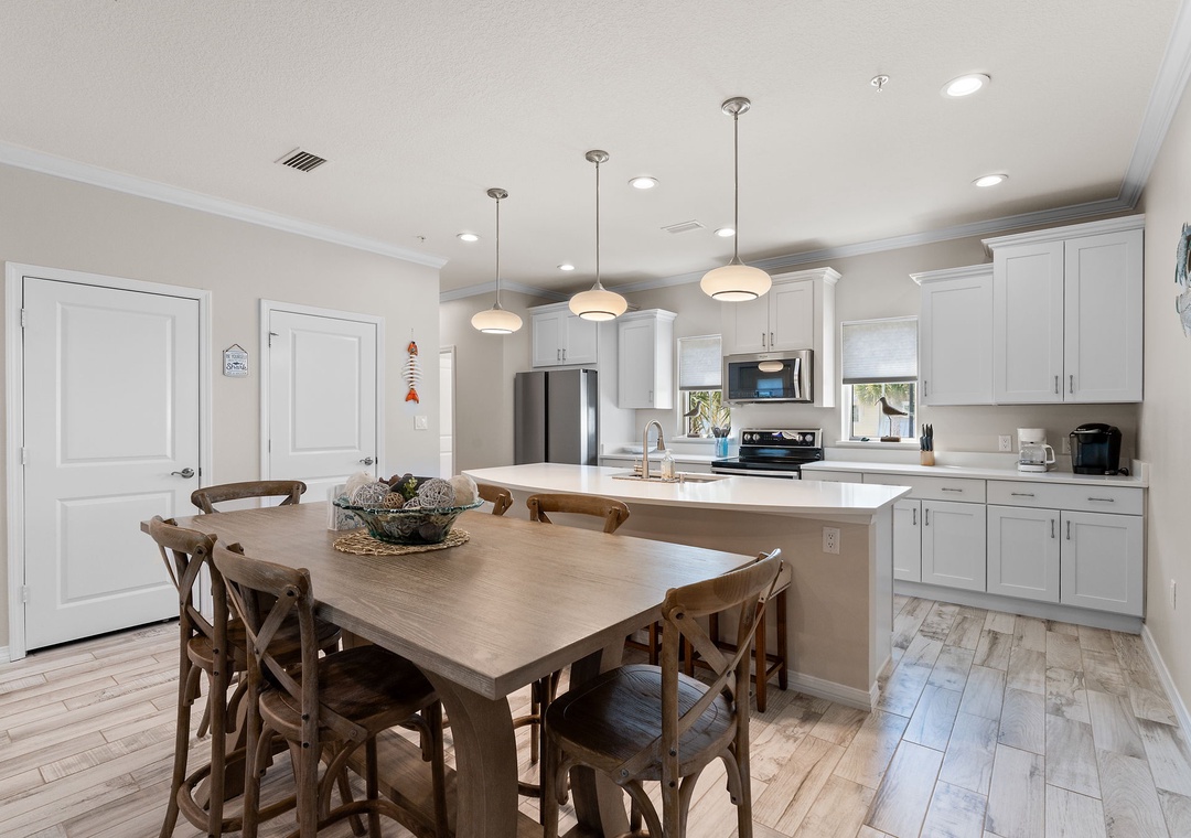 Turtles Nest- Gather around the spacious dining table and enjoy your home-cooked meals in this bright, fully-equipped kitchen with modern appliances and plenty of counter space for preparing your favorite dishes.