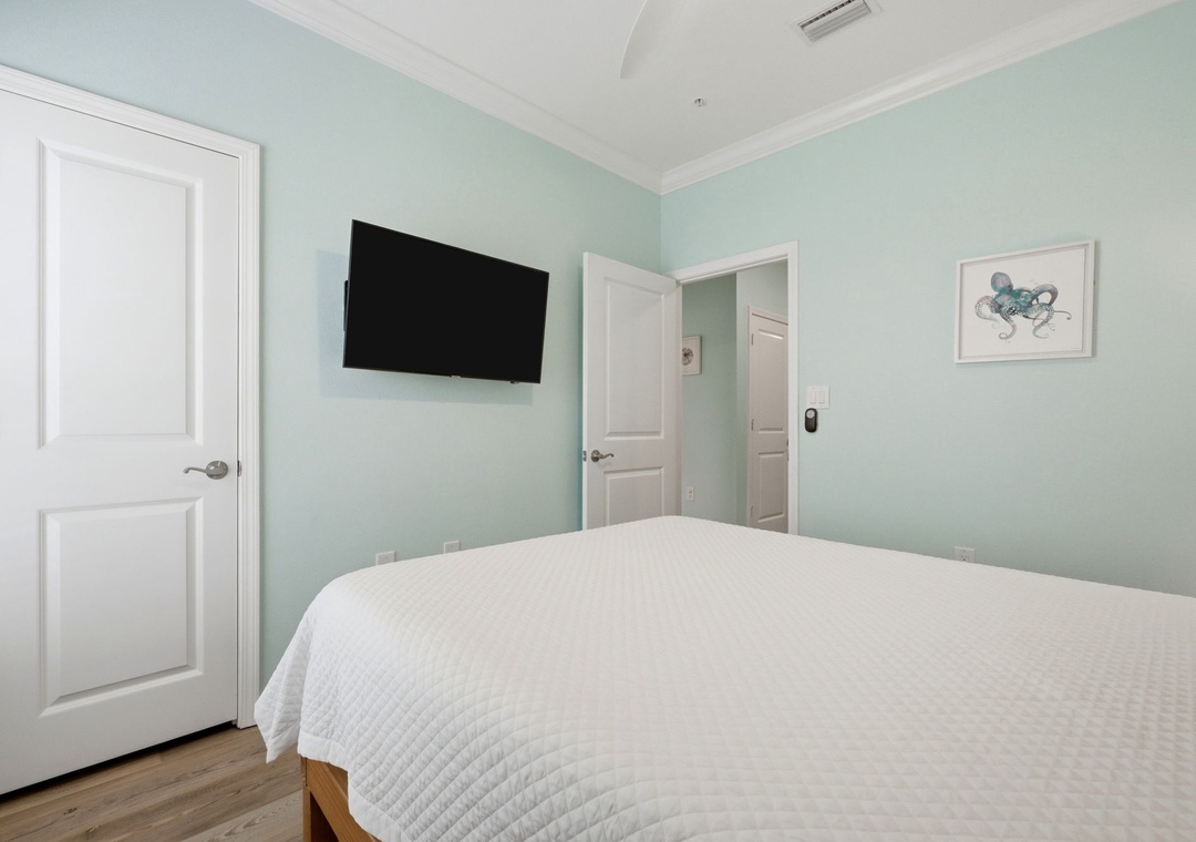 Drift into restful sleep in your serene bedroom, wrapped in soft linens and soothing coastal tones. Your private retreat features a wall-mounted TV and climate-controlled comfort for perfect relaxation.