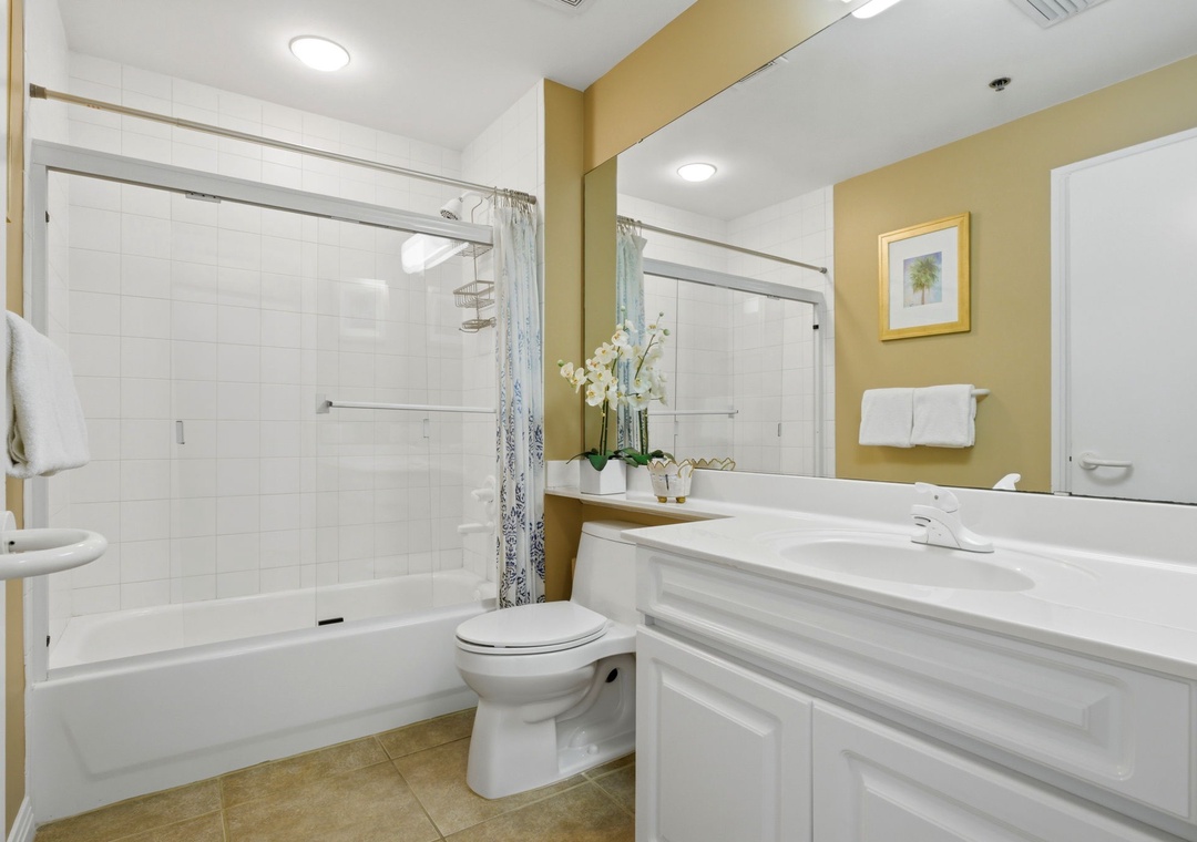 Beach Colony T PH1D-Freshen up in your private bathroom with a relaxing tub-shower combo, bright white tile, and all the space you need to unwind after a day of adventure.