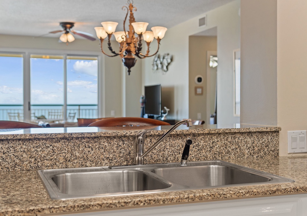 Beach Colony T15B- Wake up to stunning ocean views from your open-concept kitchen. The granite counters and spacious layout make meal prep a breeze while you soak in the coastal scenery beyond.