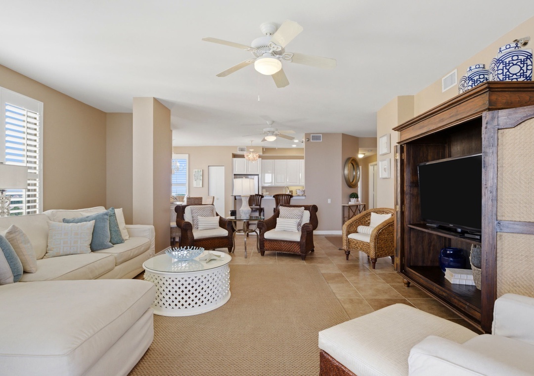 Beach Colony T PH1D- Sink into soft sofas and coastal-inspired comfort in your spacious living area, where ceiling fans keep you cool and an open layout makes relaxing effortless.