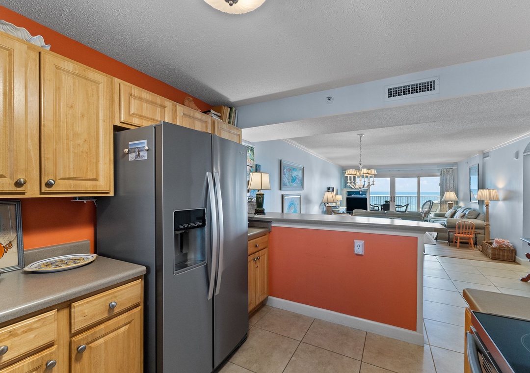 Sandy Key 338- Your fully equipped kitchen flows seamlessly into a bright living space, with an ocean view just beyond the open layout—ideal for preparing meals while staying connected to the coastal scenery.