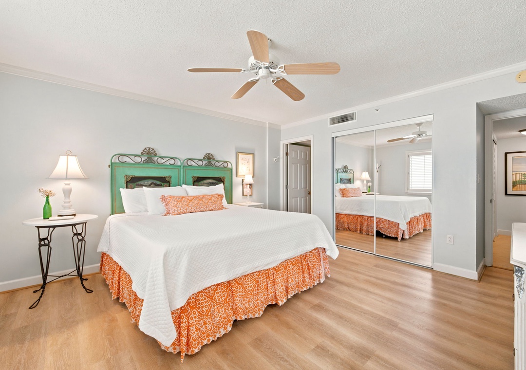 Sandy Key 338- Sink into crisp white linens and let coastal breezes from the ceiling fan drift over you as you unwind in this serene bedroom retreat with its charming vintage headboard.