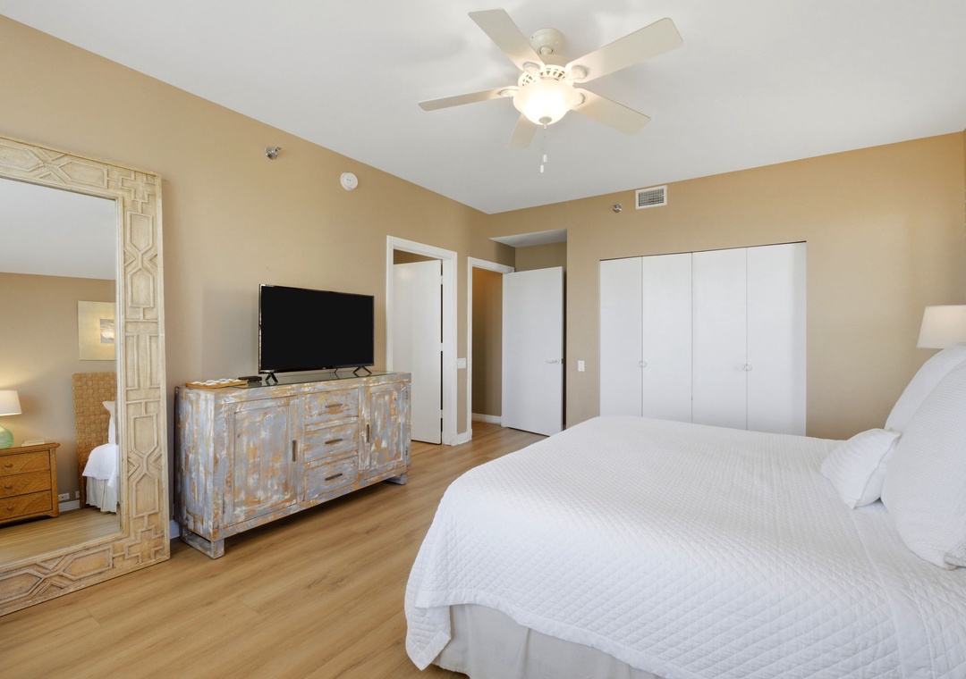 Beach Colony T PH1D-Drift off in this serene bedroom featuring a plush bed, ample storage, and a ceiling fan to keep your nights perfectly cool and comfortable.
