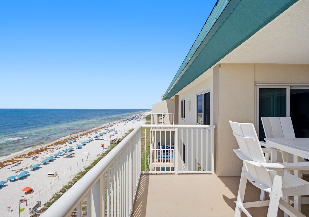 This beachfront balcony offers sweeping views of soft sand and sparkling waves, perfect for morning coffee or sunset moments. Comfortable seating invites you to unwind with the ocean breeze and coastal charm just steps away.