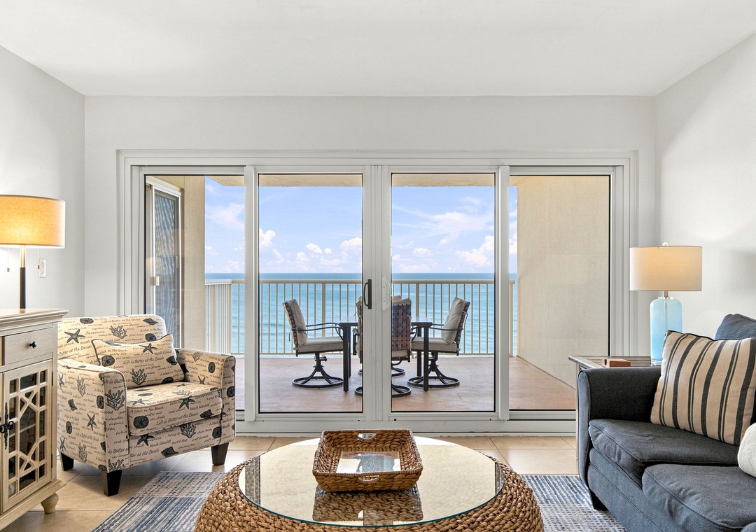 Sandy Key 411- Step into your private coastal retreat and feel the ocean breeze call. Floor-to-ceiling doors open to your balcony, where endless blue waters stretch across the horizon, inviting you to unwind.