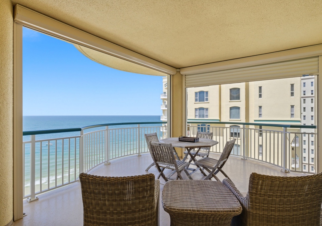 Beach Colony T PH1D-Step onto your private balcony, where wicker seating awaits and stunning ocean views stretch endlessly before you. The turquoise waters and coastal breeze create the perfect setting for morning coffee or sunset evenings.