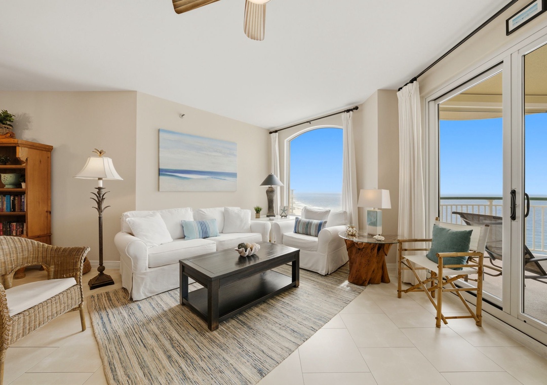 Beach Colony Tower PH1B -Relax in your sunlit coastal retreat with calming beach decor, plush seating, and stunning water views just steps from your private balcony.