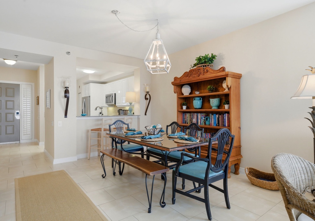 Beach Colony Tower PH1B - Gather around this welcoming dining space with seating for your whole group. The open layout flows into the kitchen, making meal times easy and together-time effortless.