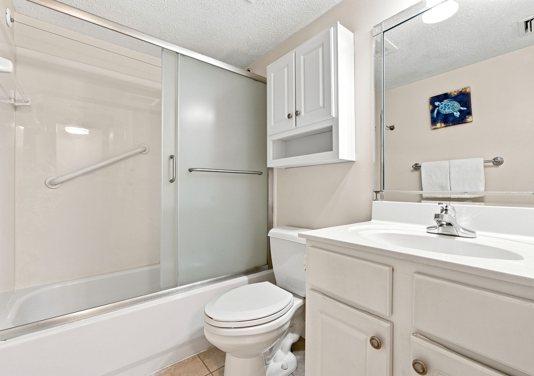 Sandy Key 411- Your private bathroom features a fresh, clean design with everything you need to freshen up after a day at the beach.