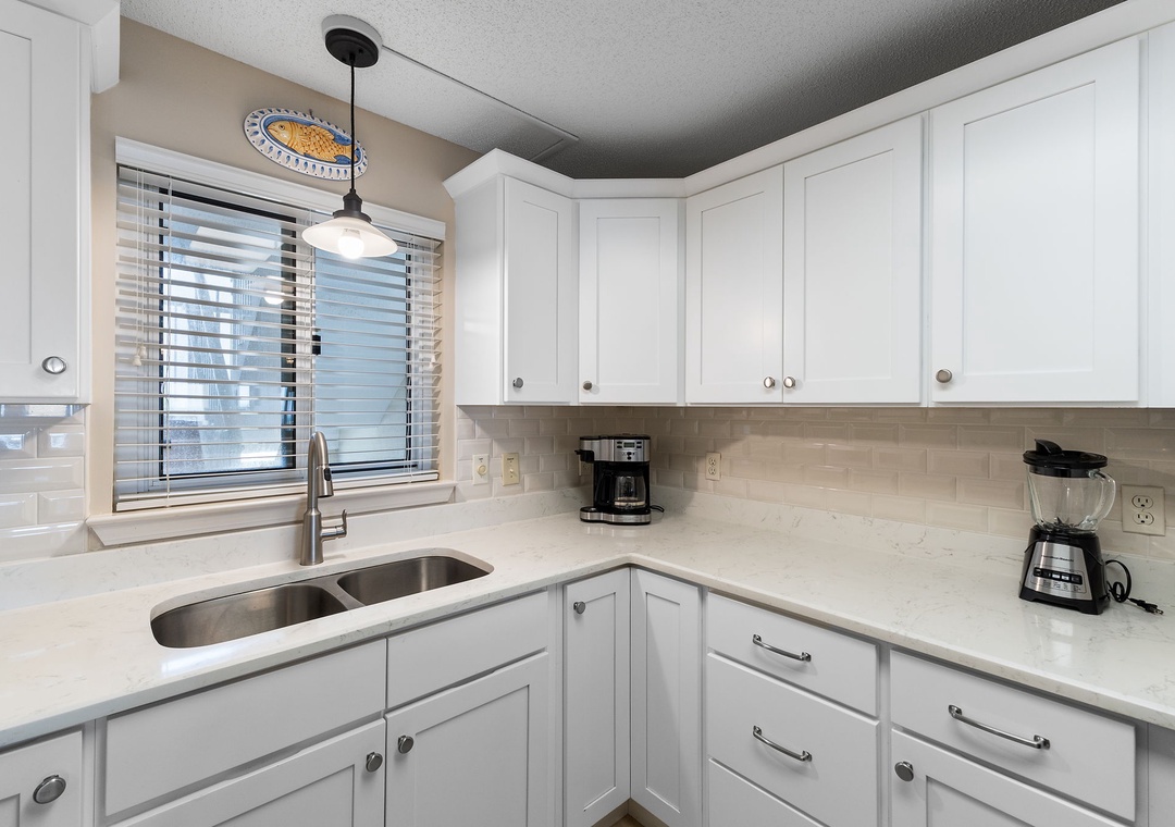 Sandy Key 628- Step into your bright, fully equipped kitchen where morning coffee and easy meal prep feel effortless. Clean counters and modern appliances make cooking a pleasure during your stay.