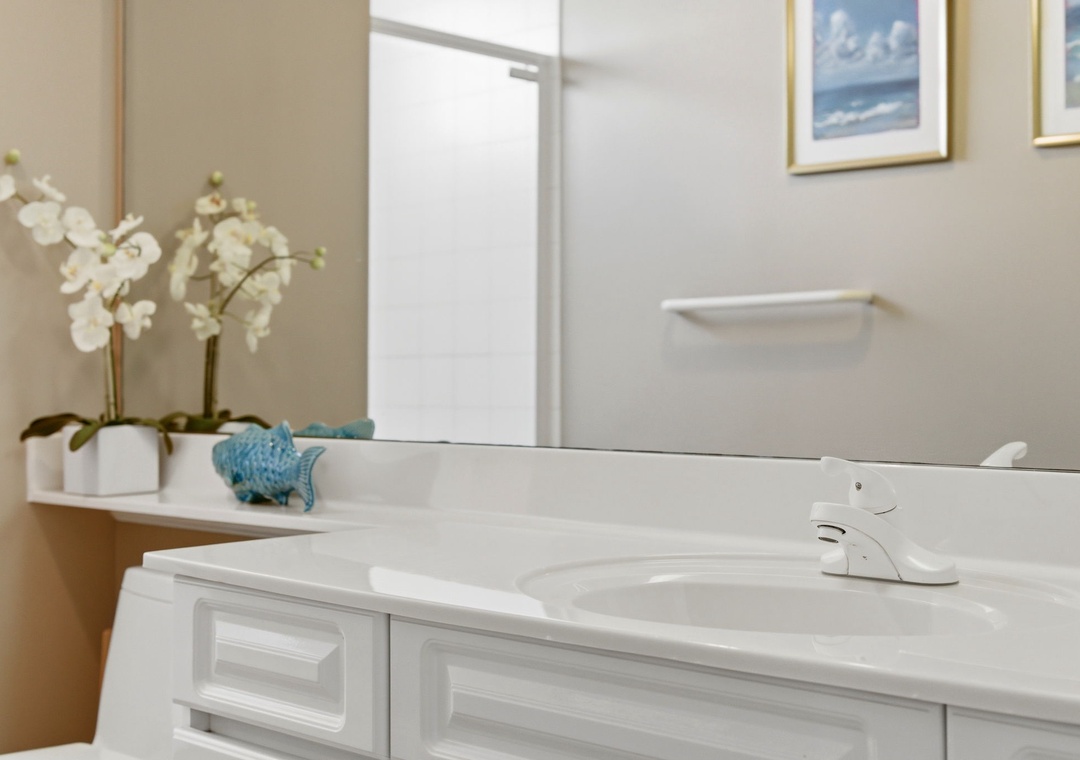 Beach Colony T PH1D-Freshen up in your stylish bathroom with coastal-inspired decor, a spacious vanity, and thoughtful touches that make you feel right at home.