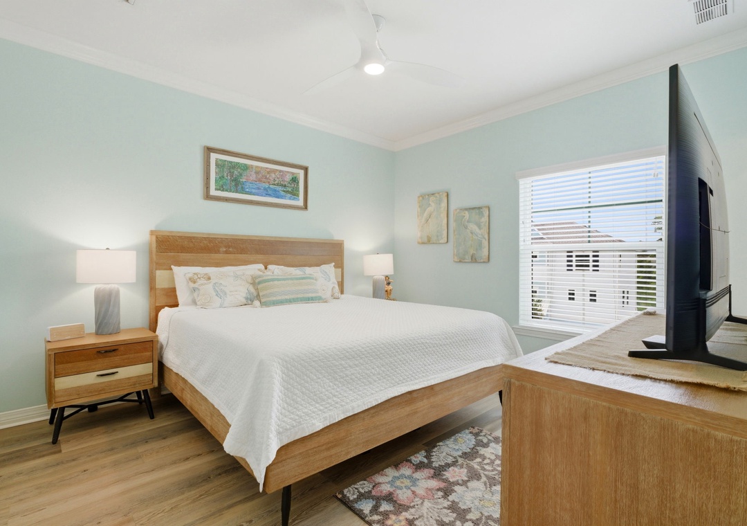Sink into the soft, crisp linens of your queen bed and unwind in this serene bedroom. Coastal hues and natural wood create a peaceful retreat for restful nights.