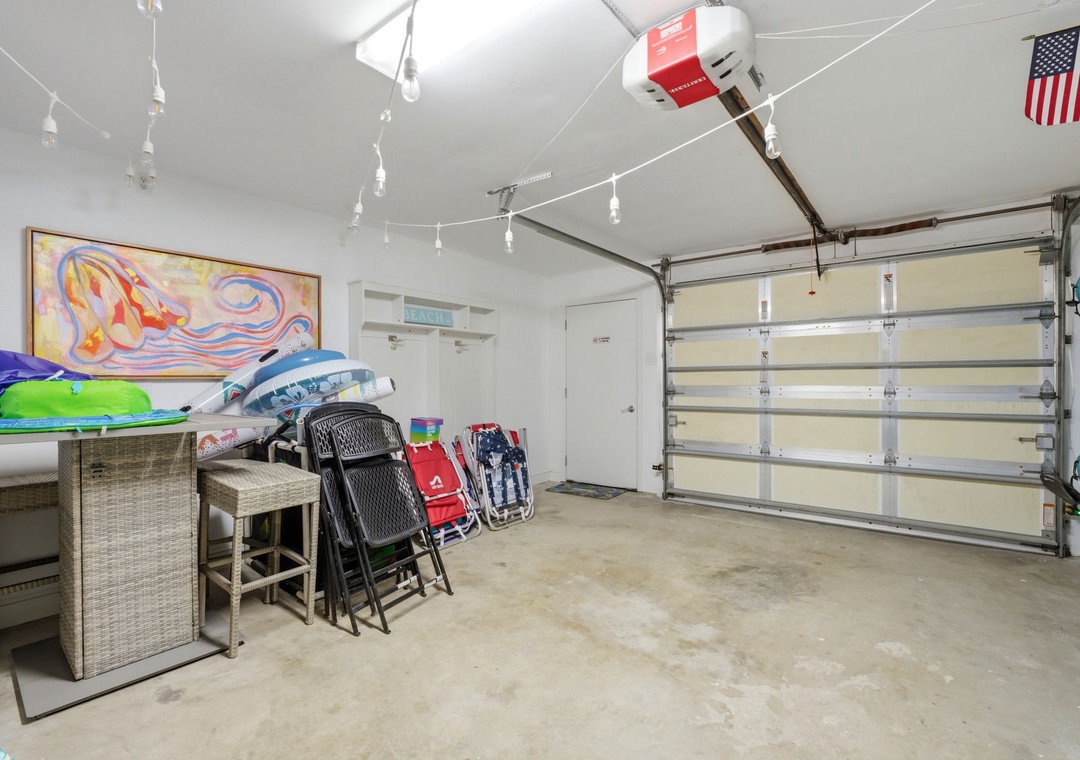 North Lost Key Landing B2- Well-organized garage with beach gear, folding chairs, and pool floats ready for your seaside adventures and outdoor fun.